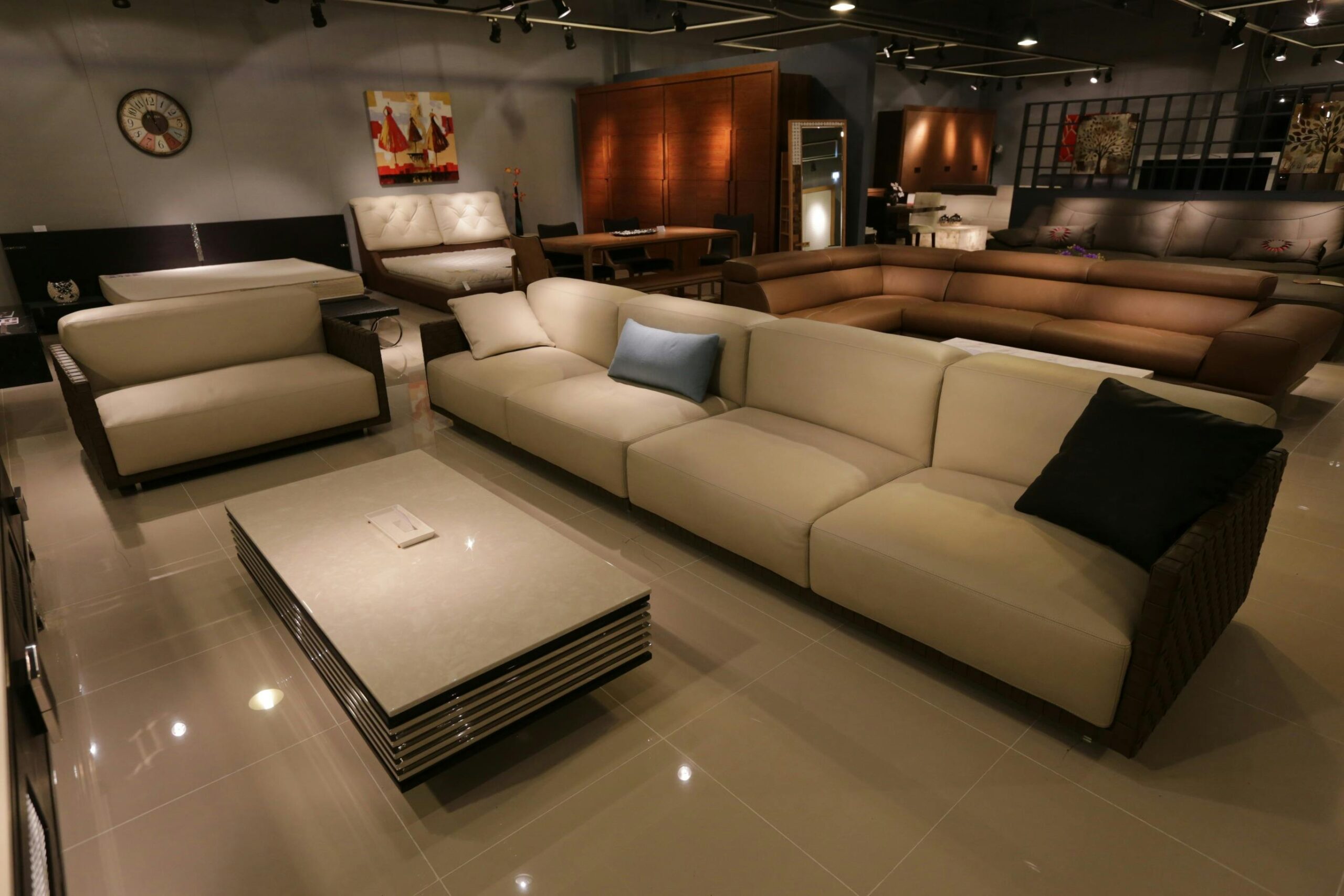 Modern beige sectional sofa with ottoman in contemporary living room setting
