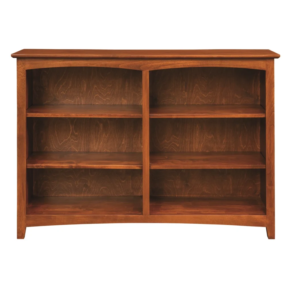 Traditional solid wood bookcase with cabinet doors displaying books in dining room setting