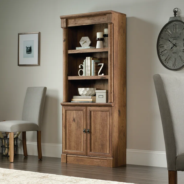 Real wood bookcase with storage doors and open shelves for books and decor in modern living room