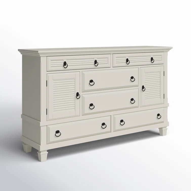 Antique white dresser with louvered cabinet doors, multiple drawers, and coastal cottage styling on white background